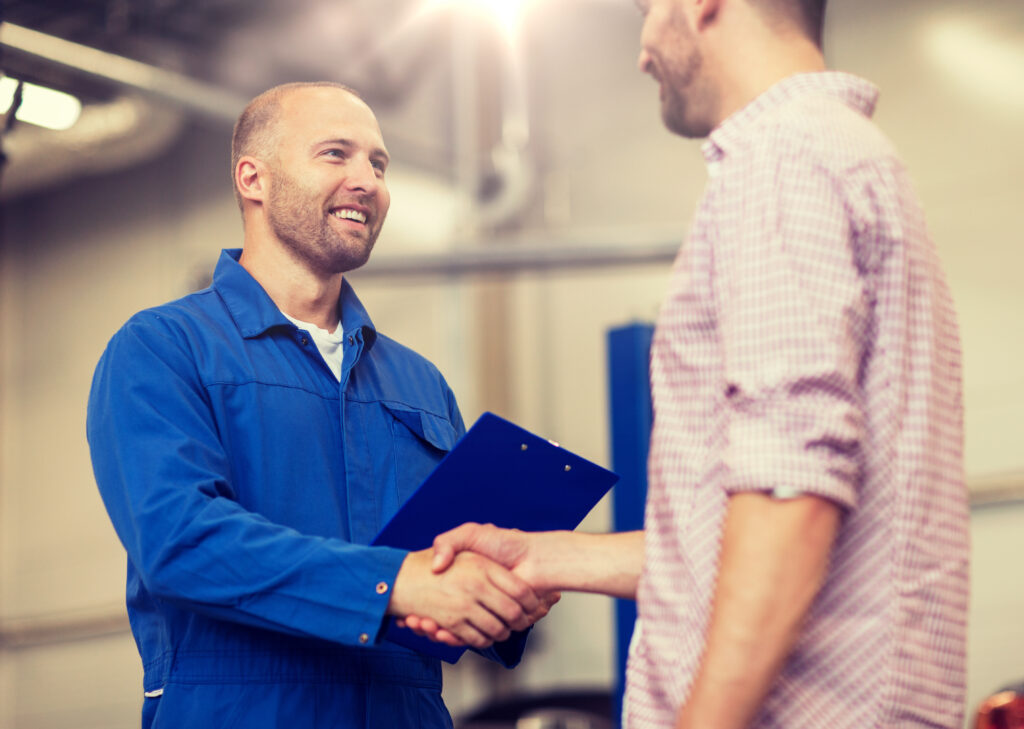 HVAC technician shaking client's hand